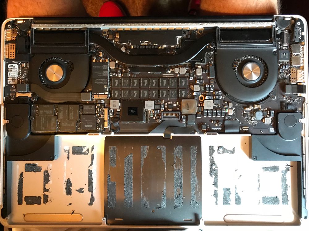 Old battery out. The trackpad is just under the center plate in a darker color.